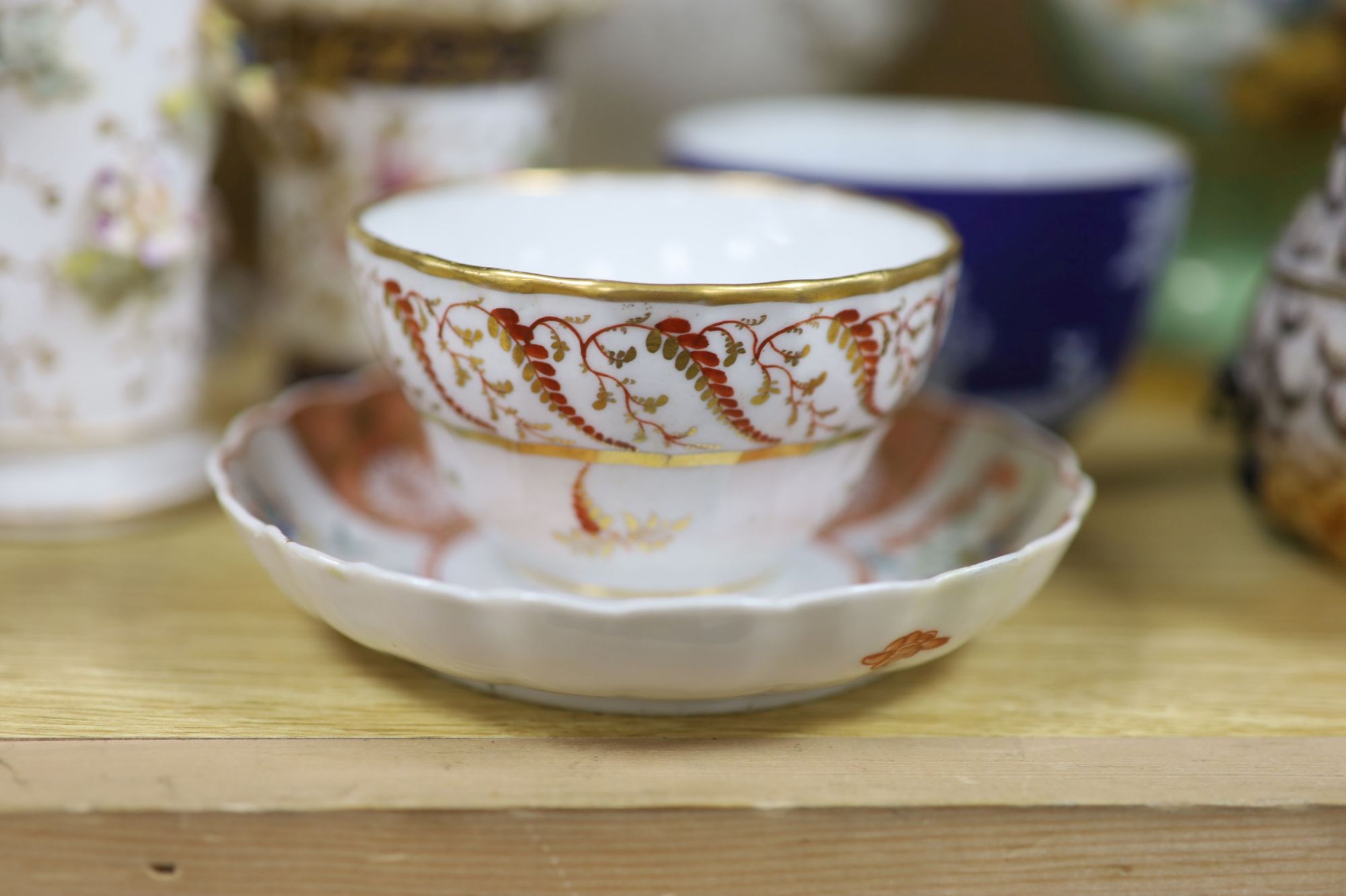 A group of mixed ceramics including a Copeland flower-painted vase, a Staffordshire hen and chick tureen and cover, Staffordshire cot